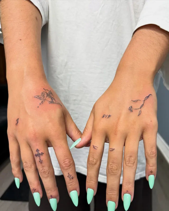 Fine-line hand and finger adornment tattoos on both hands